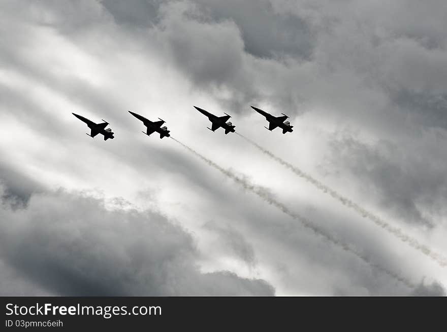 F-5 fighters flying in cloudy conditions. F-5 fighters flying in cloudy conditions