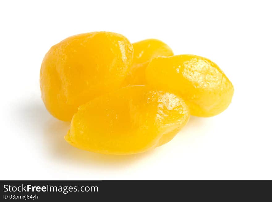 Dried lemons in sugar syrup close-up Isolated over white background