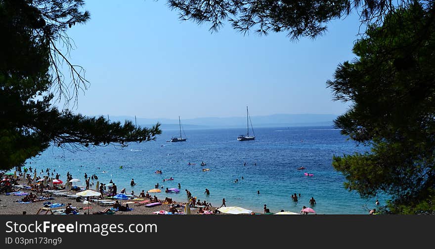 Spectacular Bol, Island of Brac in Croatia, crowded with people and boats near the shore. Spectacular Bol, Island of Brac in Croatia, crowded with people and boats near the shore