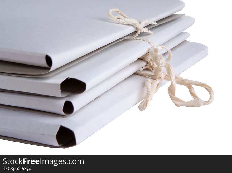 Bunch of white cardboard folder with ties. Bunch of white cardboard folder with ties