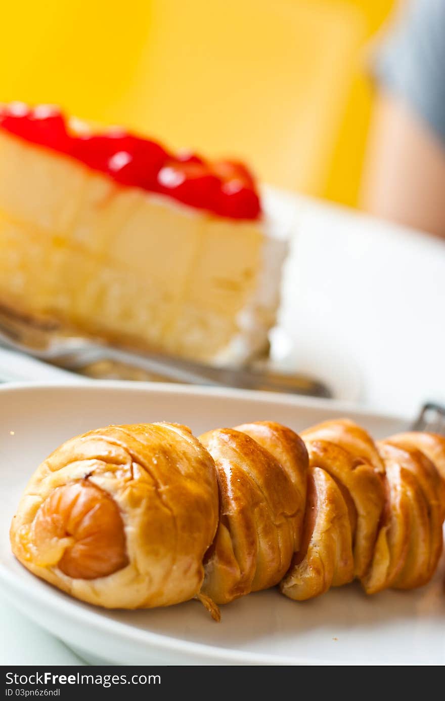 Strawberry Cheesecake and croissant in the coffee shop. Strawberry Cheesecake and croissant in the coffee shop