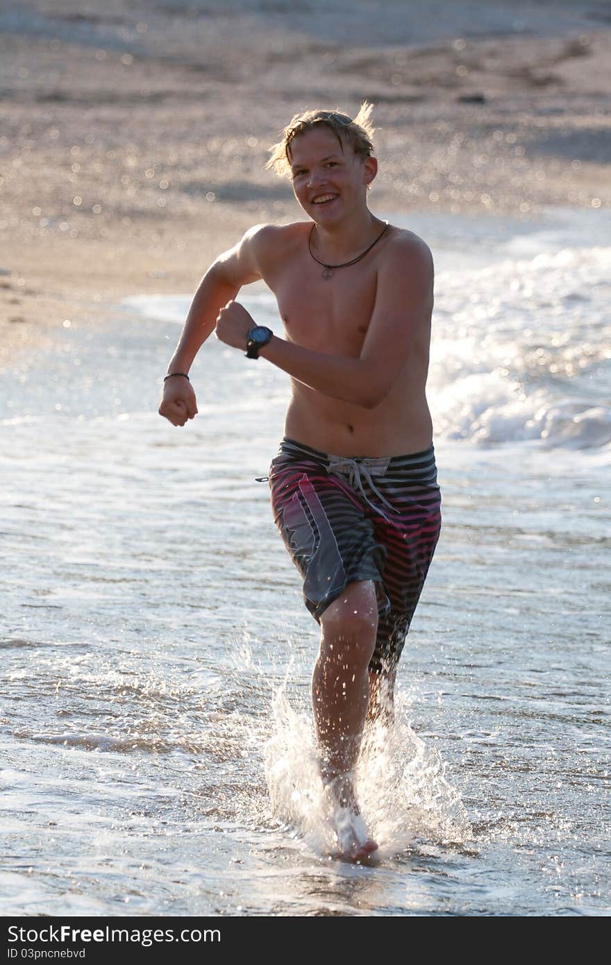 Man running on a beach