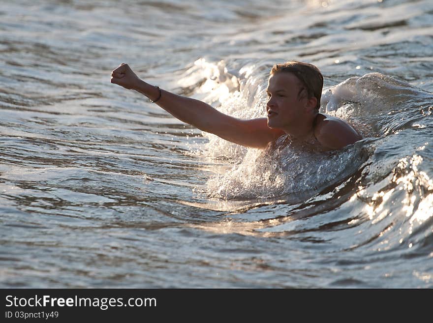 Boy pushed by the wave