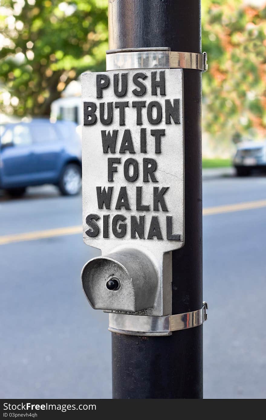 Walk signal button at a pedestrian crosswalk