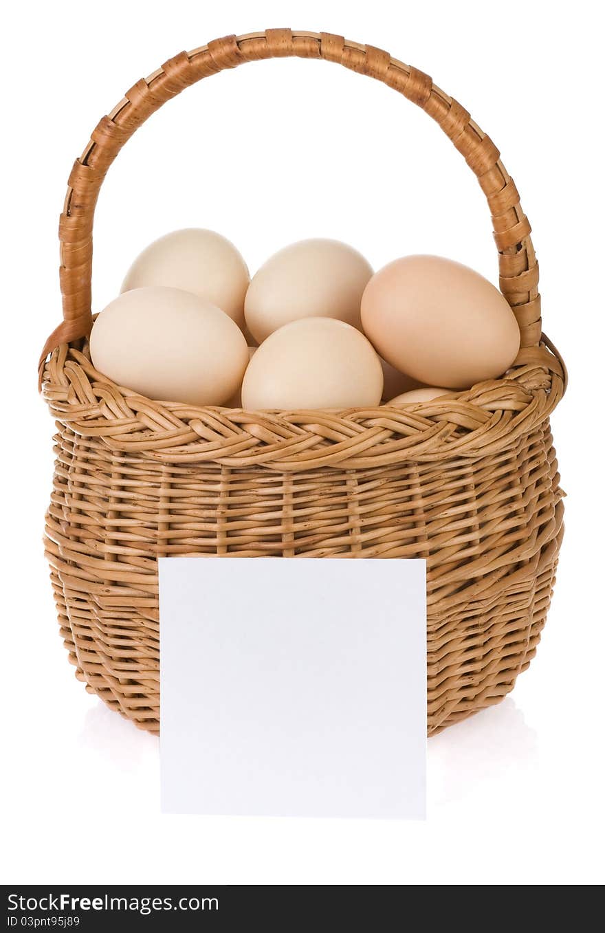 Eggs and basket on white background