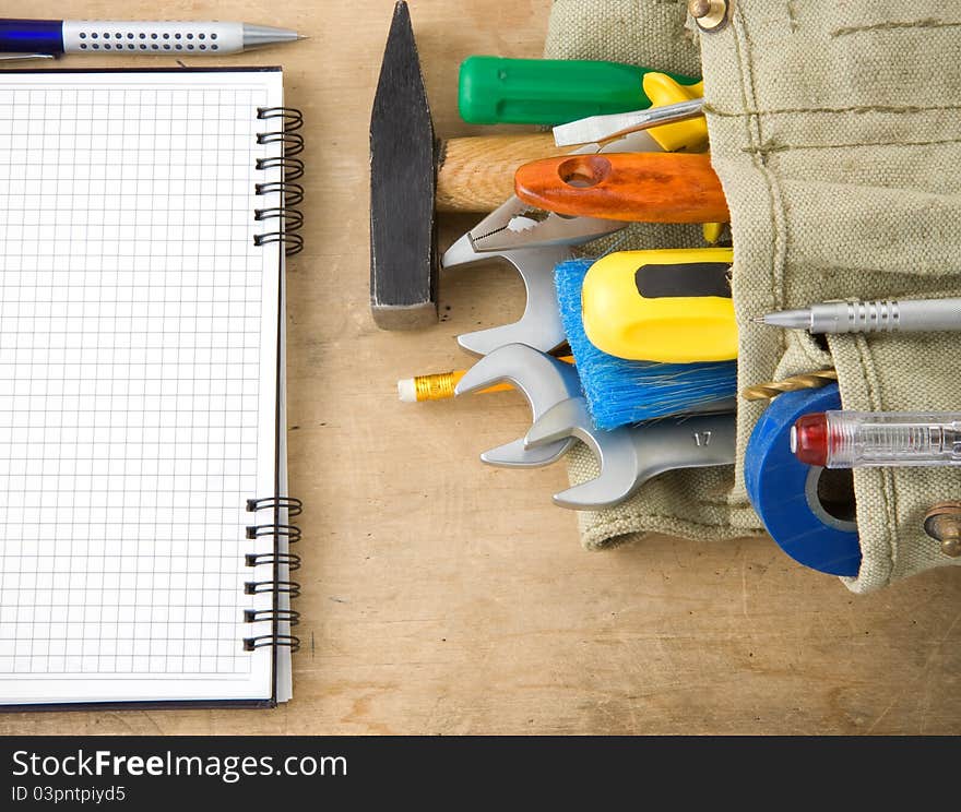 Tools And Notebook On Wood