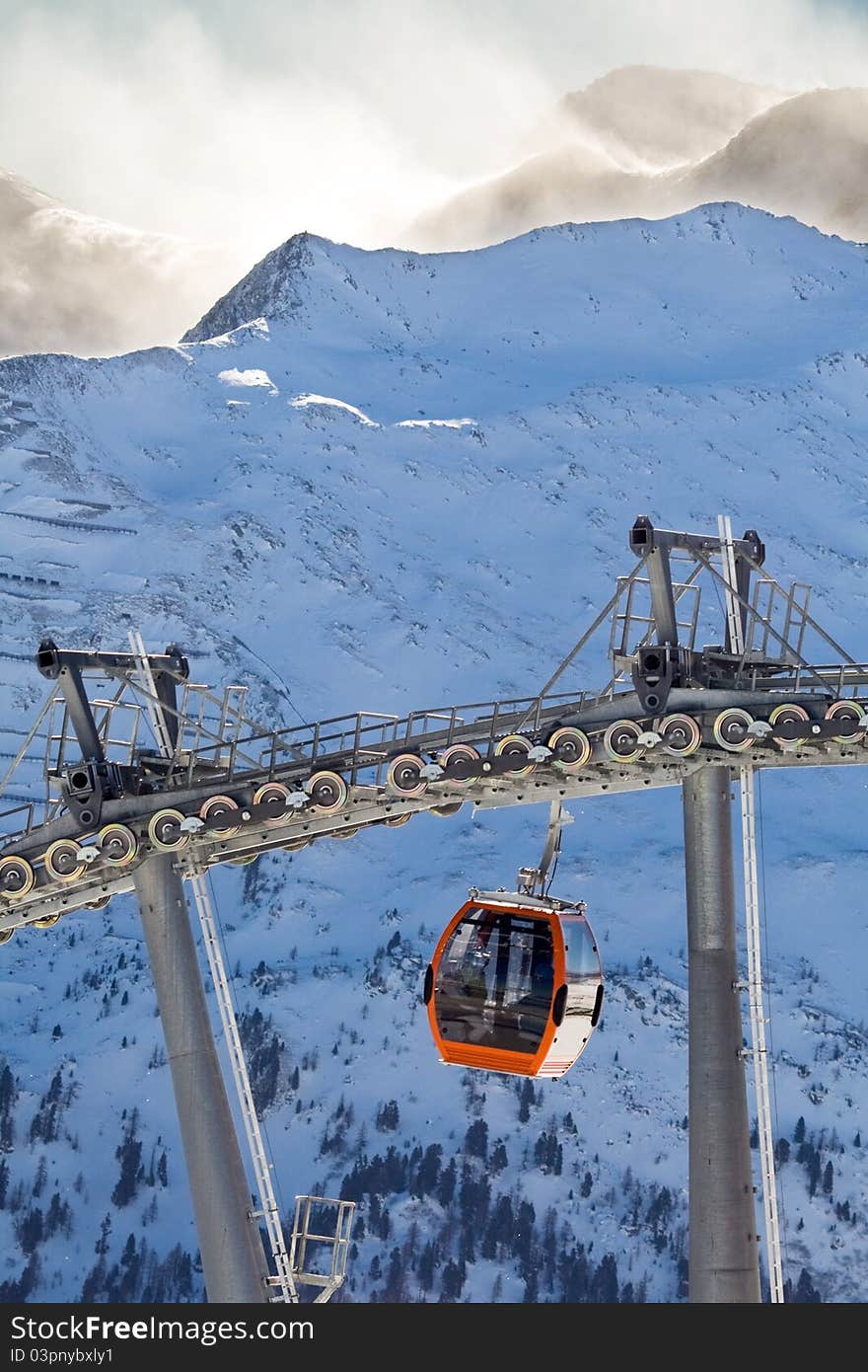 Snowboard and Ski Extreeme sport on the European Alps. Above beautiful sky on the snowy mountain.