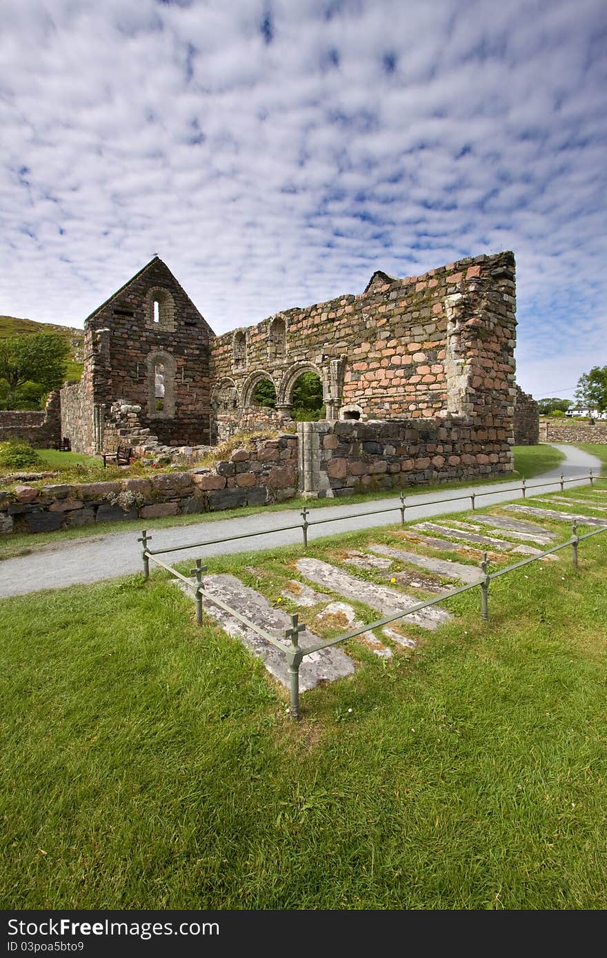 Iona Nunnery ruins on the Isle of Iona in the Inner Hebrides on the West Coast of Scotland. The ancient graves in the foreground are of former nuns.