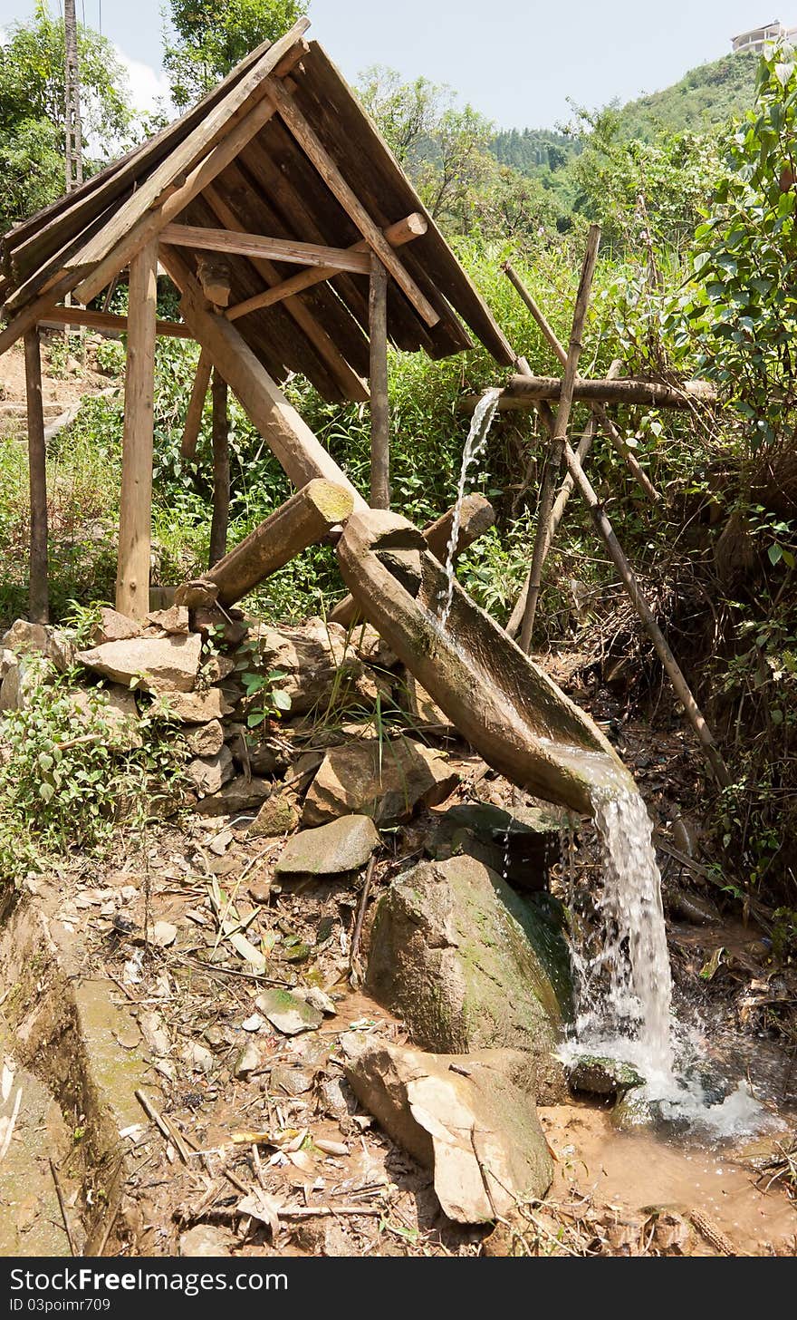 A structure helping to redirect water running from the mountains to bring to rice fields, which is widely used in Sapa, Vietnam. A structure helping to redirect water running from the mountains to bring to rice fields, which is widely used in Sapa, Vietnam.