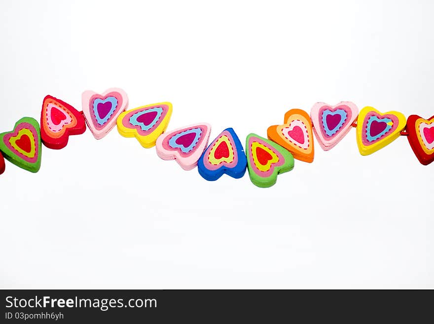 Wooden hearts with colorful elements. Wooden hearts with colorful elements