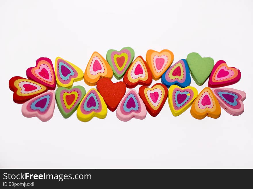 Wooden hearts with colorful elements. Wooden hearts with colorful elements