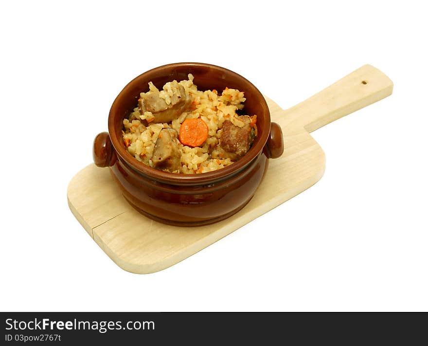 Rice with meat in a ceramic bowl isolated on white background