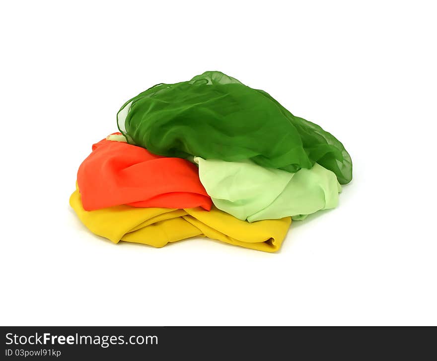 Heap of colorful silk isolated on white background