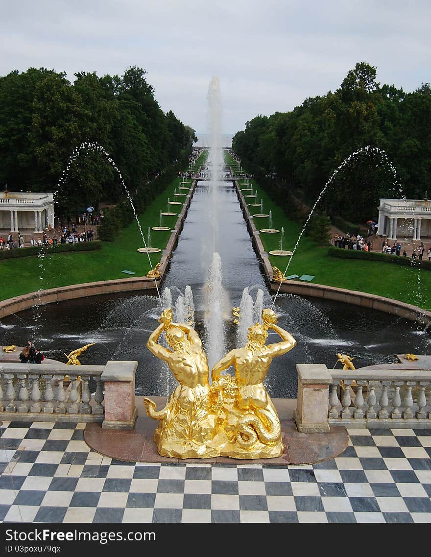 Water channels and fountains Petergofa on background Petrova palace