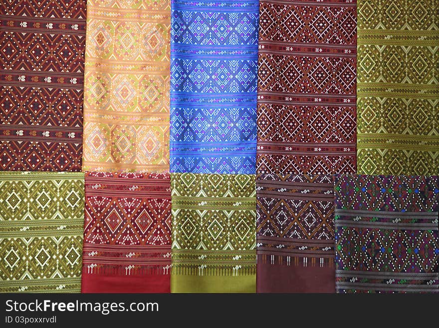 Pieces of colorful praewa silk fabric cloth using as background. Pieces of colorful praewa silk fabric cloth using as background