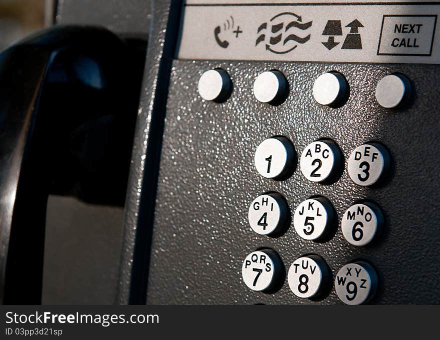 Keypad and front panel from a public telephone. Keypad and front panel from a public telephone.