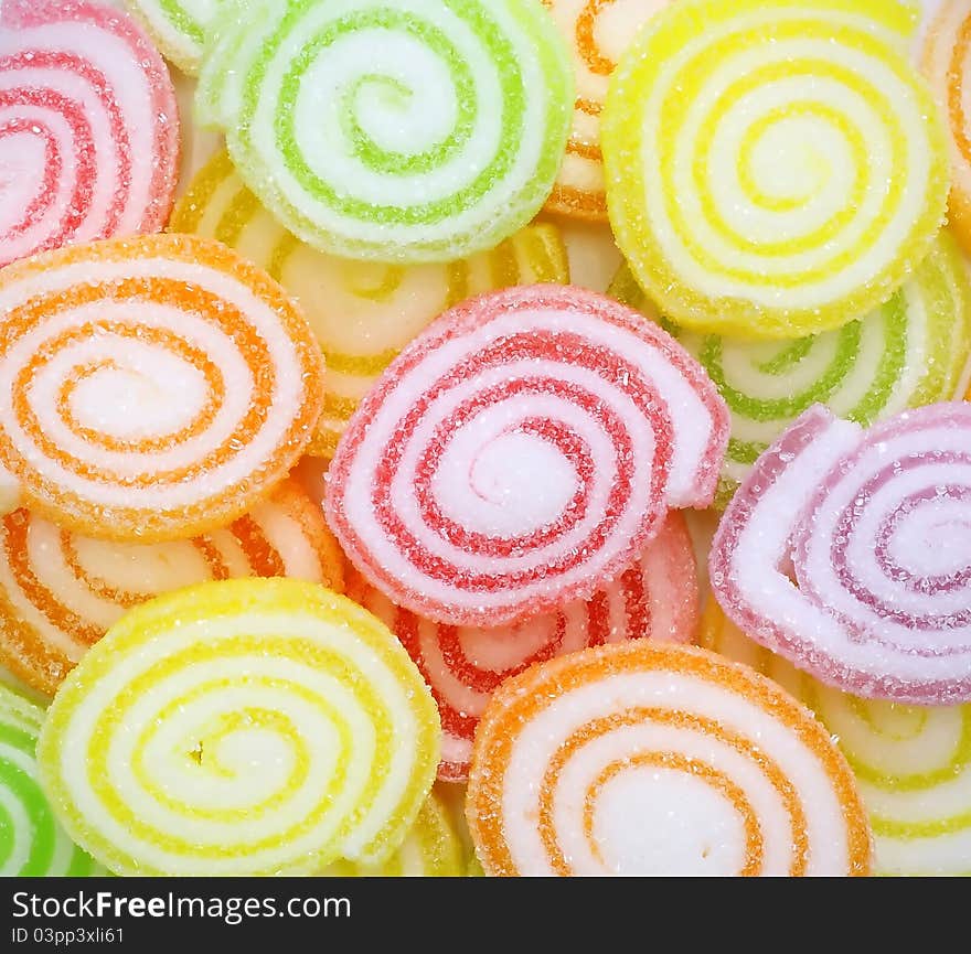 Close-up of colorful candy on white background.