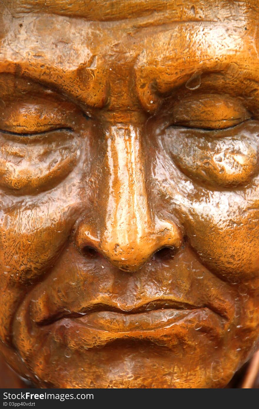 Traditional Thai style face of the monk image, Somdet Too, in front of church, Wat Naga Wichai, Mahasarakam, Thailand