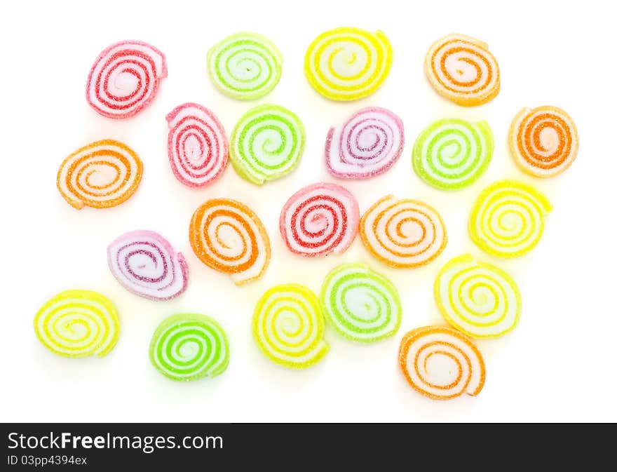 Close-up of colorful candy on white background.