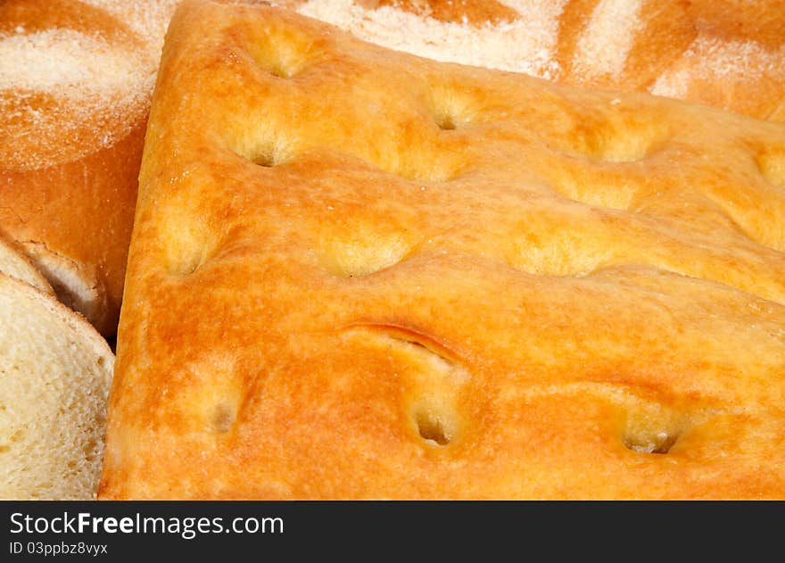 Close up genoese (or genovese) focaccia and bread. Close up genoese (or genovese) focaccia and bread