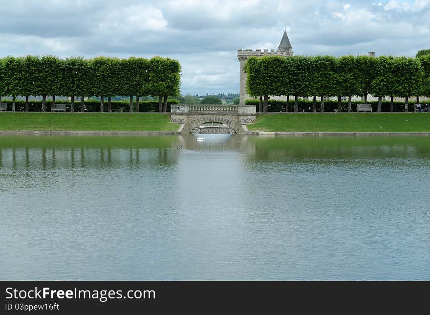 Villandry castle is famous more for the garden 'à la francaise' than for the castle itself. Here is a picture of the pond with the two towers of the castle in the background. Villandry castle is famous more for the garden 'à la francaise' than for the castle itself. Here is a picture of the pond with the two towers of the castle in the background.