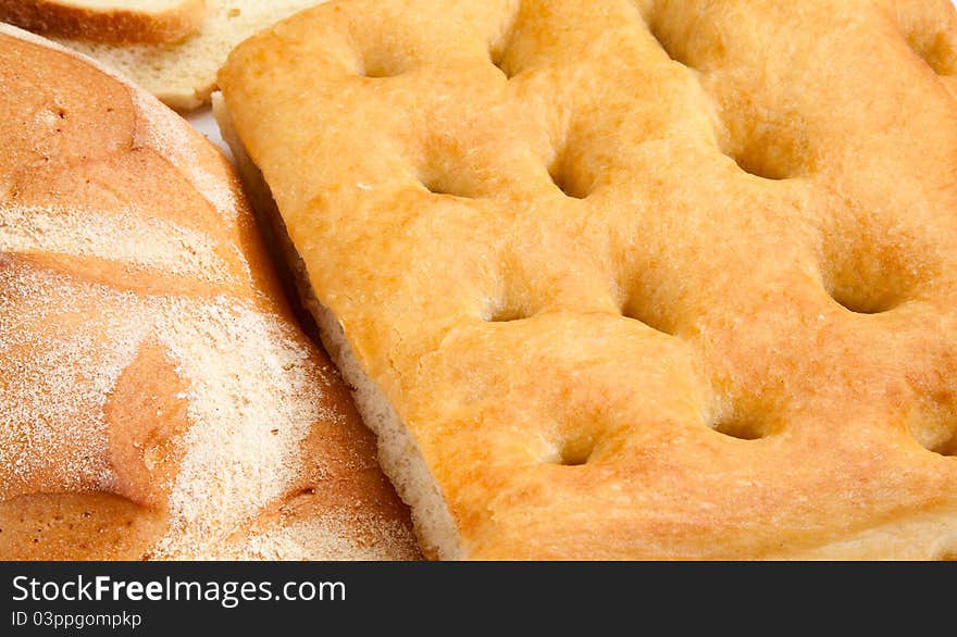 Close up of genoese (or genovese) focaccia and bread. Close up of genoese (or genovese) focaccia and bread