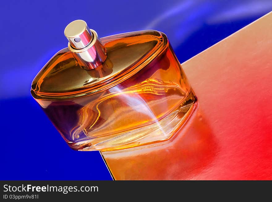 Perfume bottle on a colorful background.