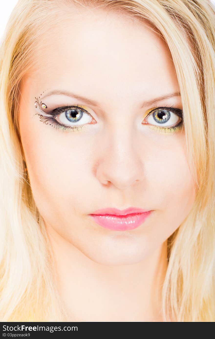 Young beautiful blonde woman with stylish make-up