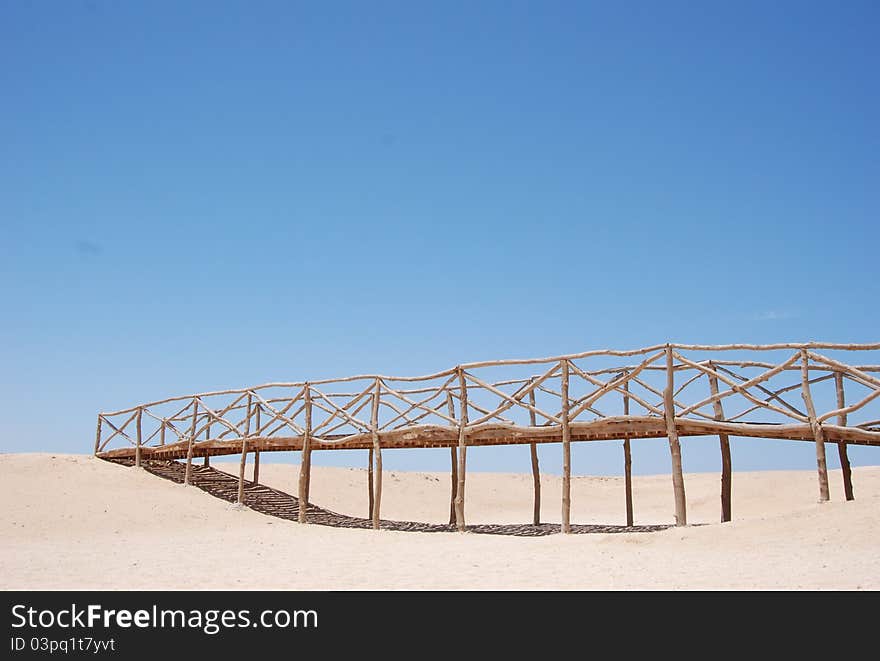 Wooden bridge at desert-island in Egypt. Wooden bridge at desert-island in Egypt.