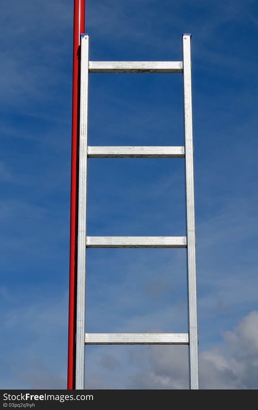 Abstract concept. Metallic stairs against the blue sky. Abstract concept. Metallic stairs against the blue sky