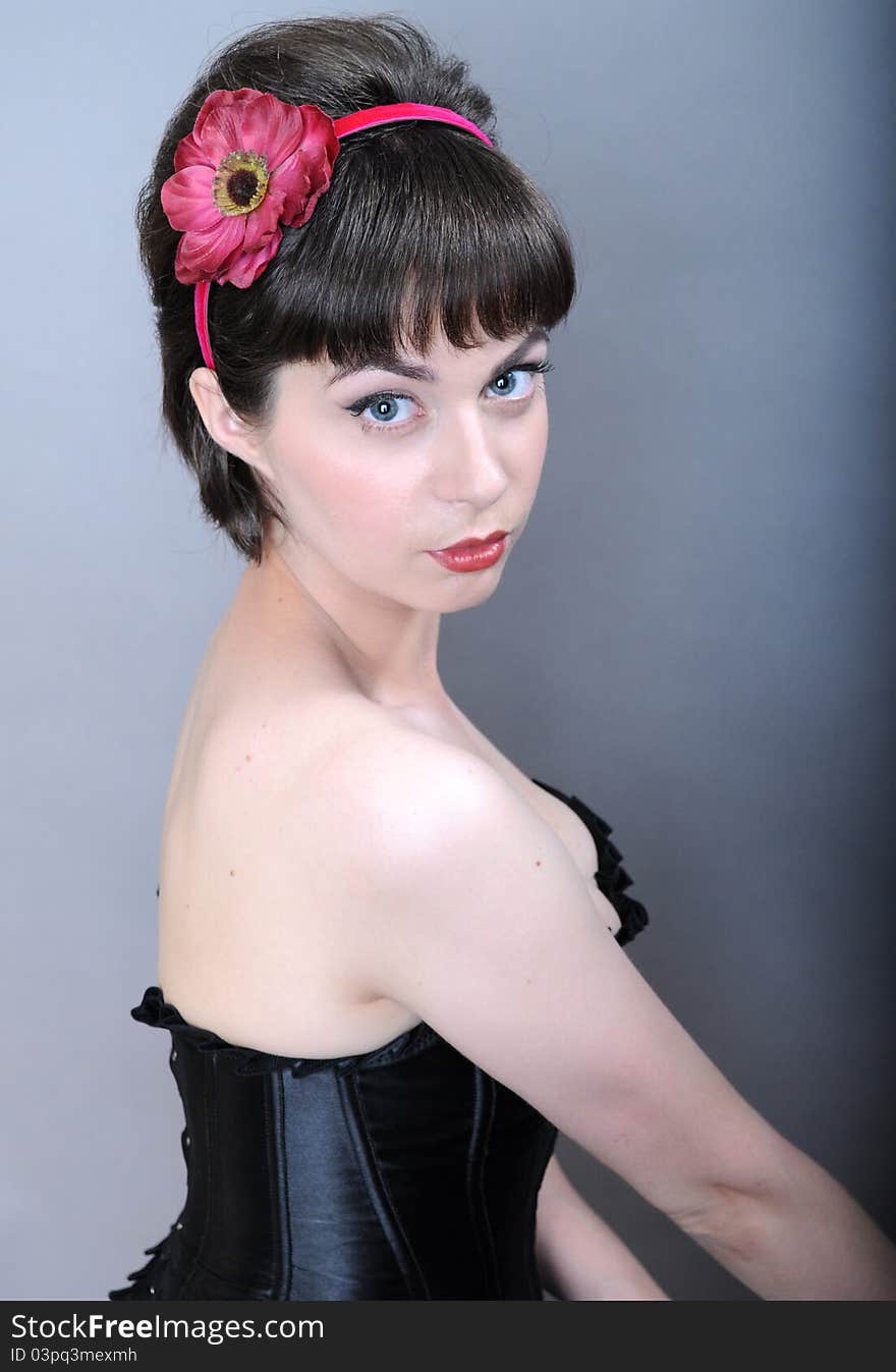 Portrait young beautiful woman in the studio, closeup