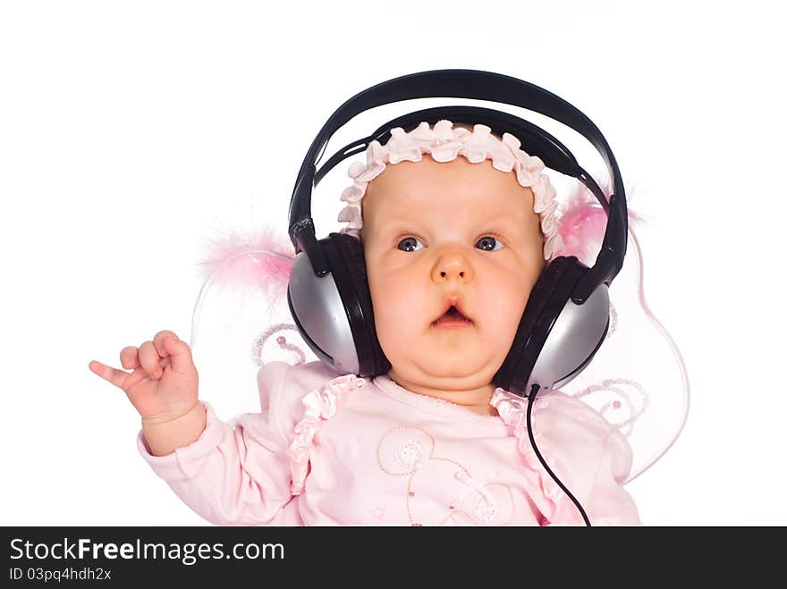 Cute baby with headphones on a white