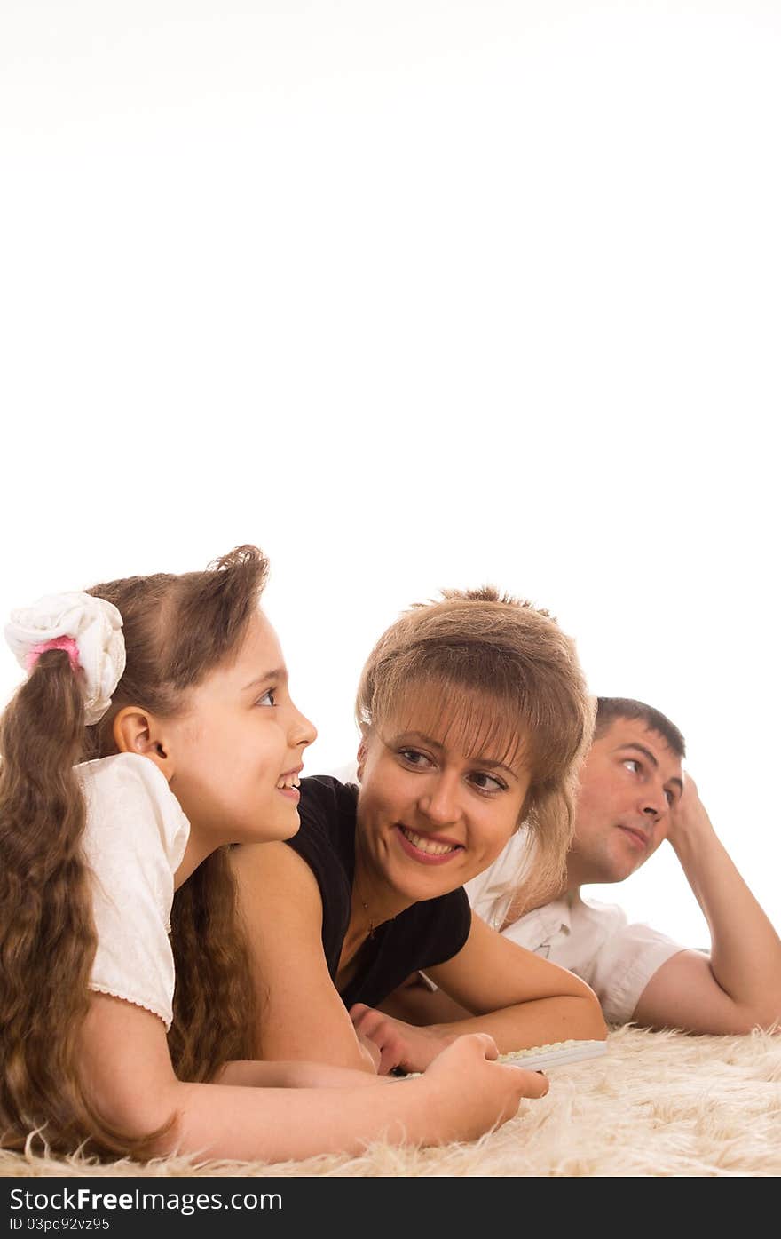 Portrait of a cute family on a carpet. Portrait of a cute family on a carpet