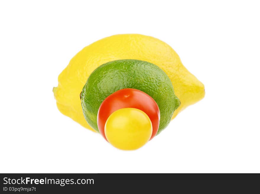 Fresh lemon lime and tomato isolated on white. Fresh lemon lime and tomato isolated on white