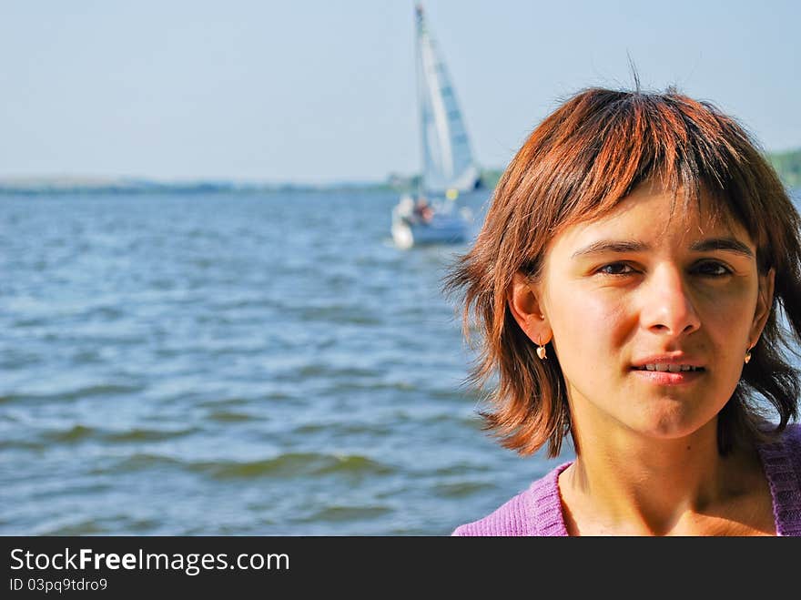 Beautiful young woman near the lake. Beautiful young woman near the lake