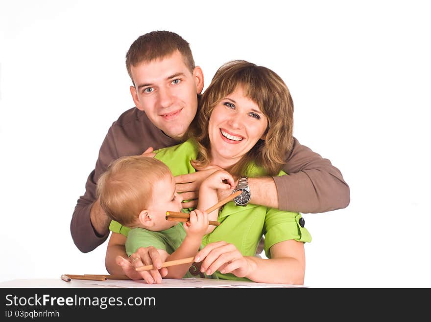 Portrait of a cute family drawing at table. Portrait of a cute family drawing at table