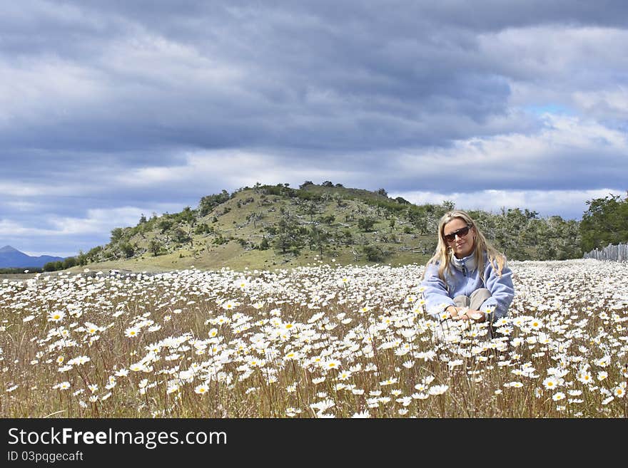 Woman in a daisy field