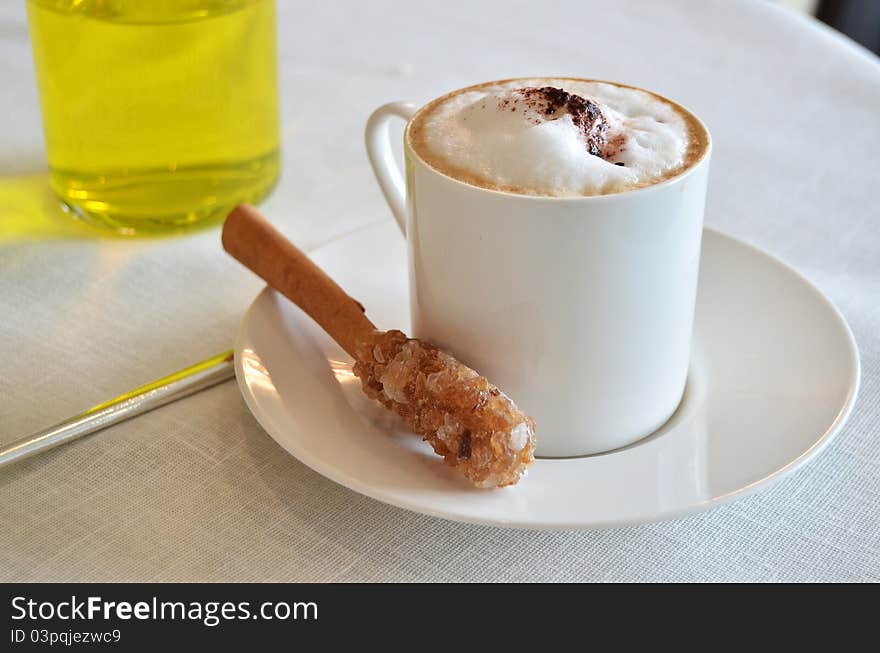 Cup Of Hot Cappuccino Coffee On Table