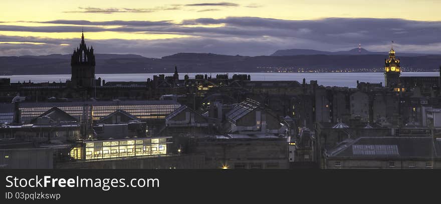 A view of the Edinburgh skyline around twilight, with the Firth of Forth and the Kingdom of Fife in the background. A view of the Edinburgh skyline around twilight, with the Firth of Forth and the Kingdom of Fife in the background.