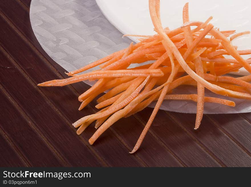 White rice paper and shredded orange carrots. White rice paper and shredded orange carrots.