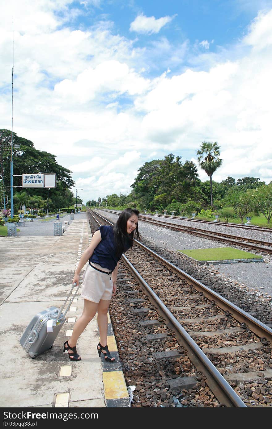 Woman leaving travels from there with her luggage