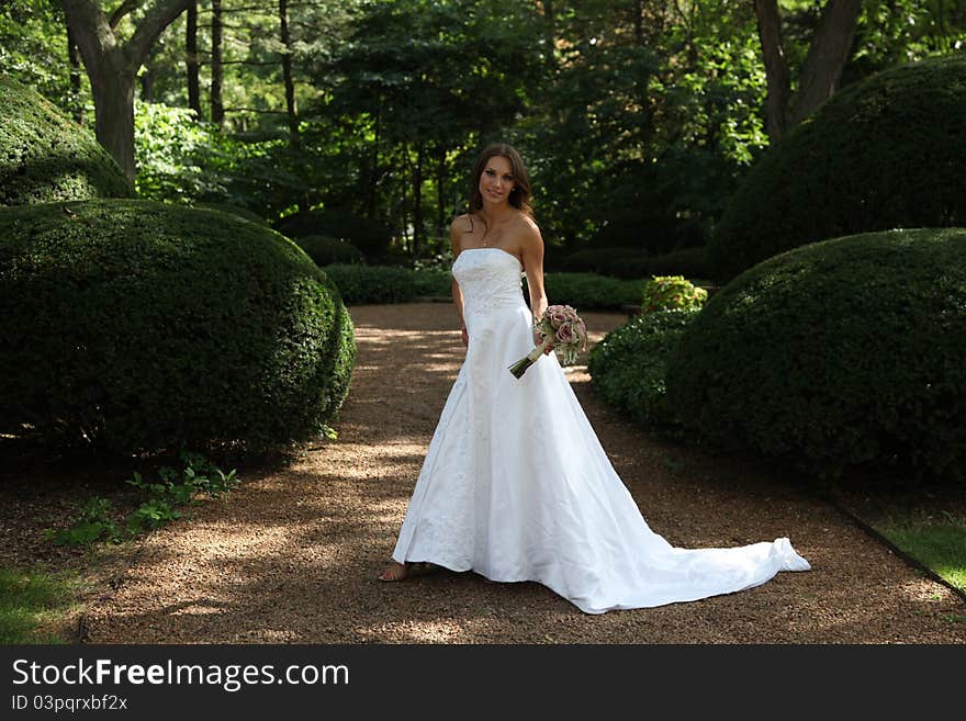 A bride walking through the forest