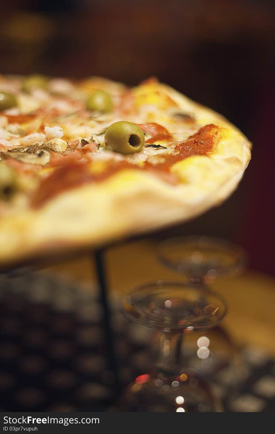 Pizza with wine upside down glasses