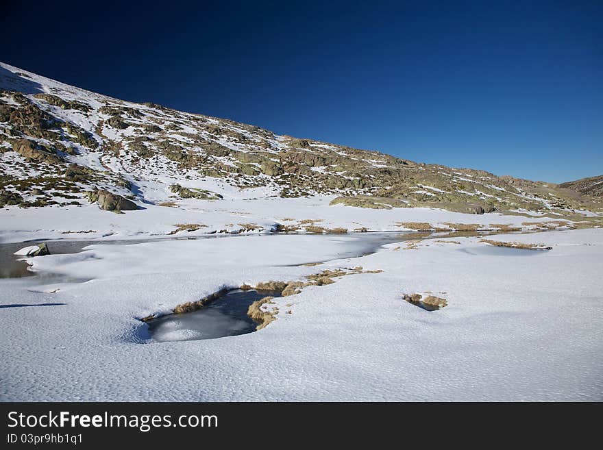 Iced lake at Gredos mountains