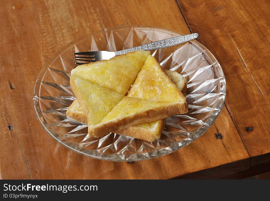 Buttered toast topped with sweetened condensed milk It is easy to eat breakfast with coffee. Buttered toast topped with sweetened condensed milk It is easy to eat breakfast with coffee.