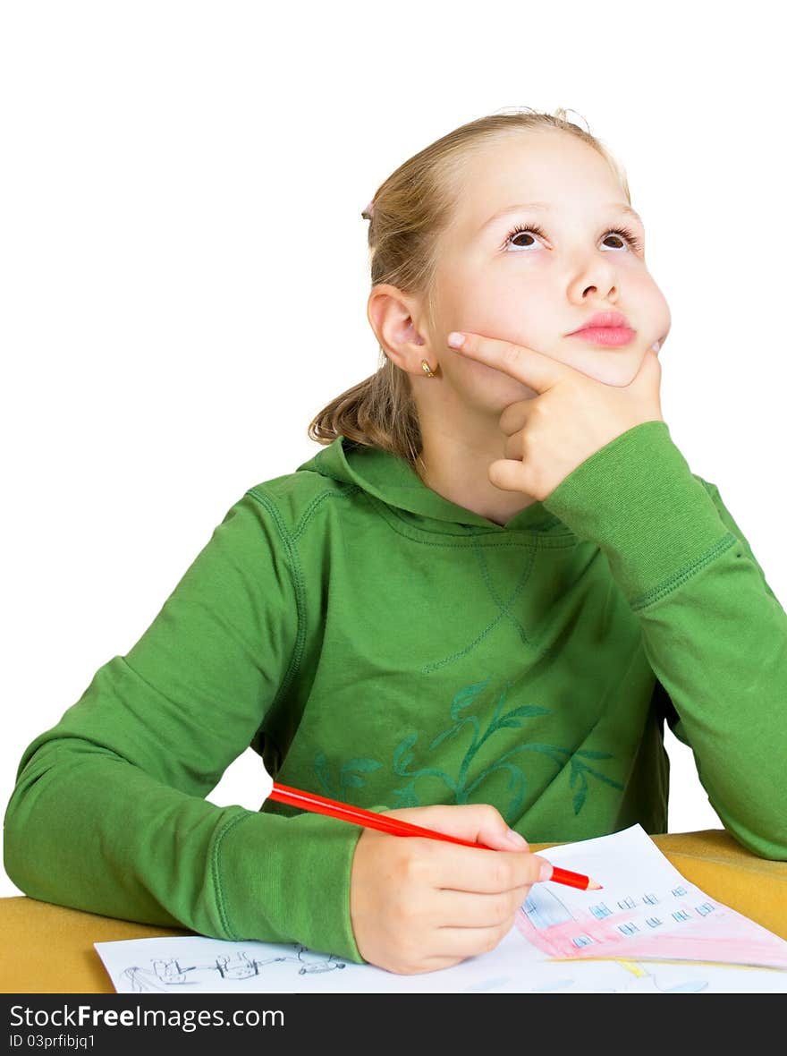 Little girl dreaming at the table on white