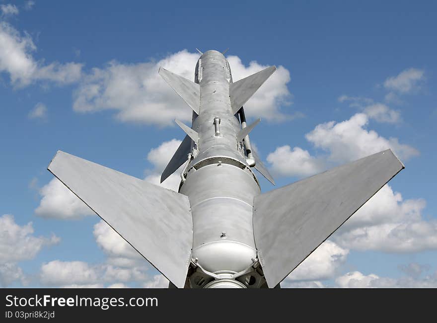 Cruise missile and a blue sky with clouds. Cruise missile and a blue sky with clouds