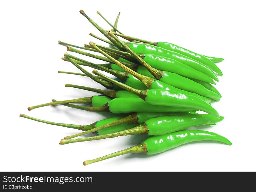 Many green chili for cooks on white background , it's spicy. Many green chili for cooks on white background , it's spicy