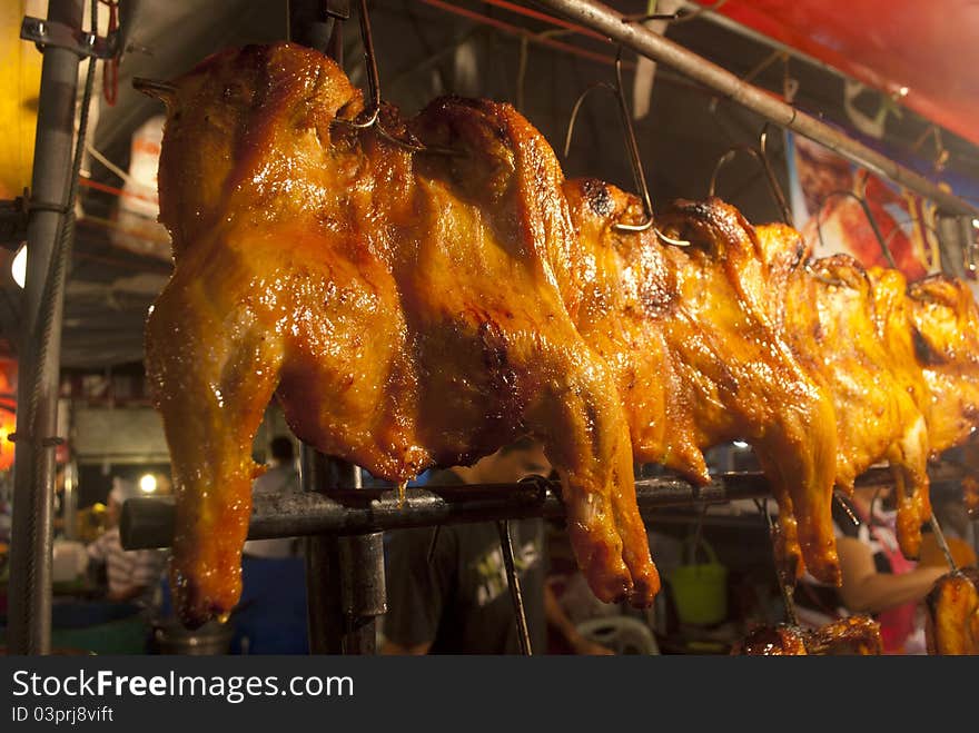 Roasting chicken in night market , Roasting chicken for dinner