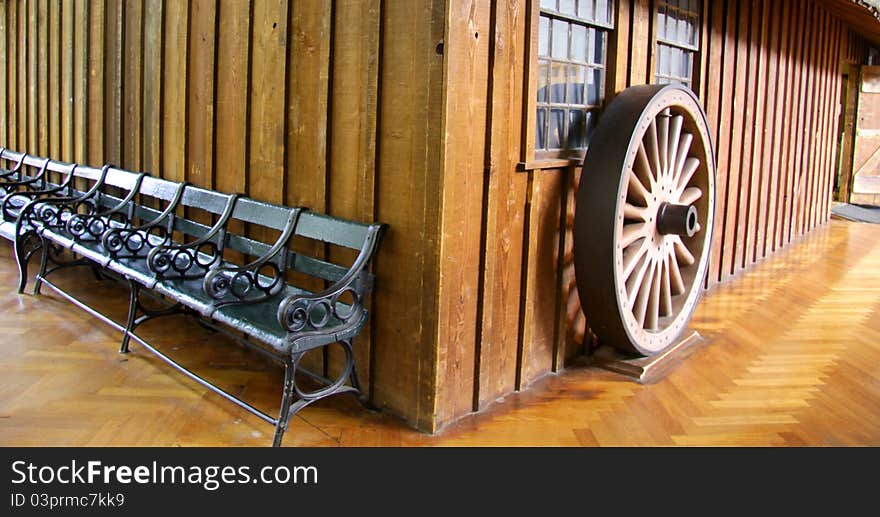 Historic home with old benches and wheel